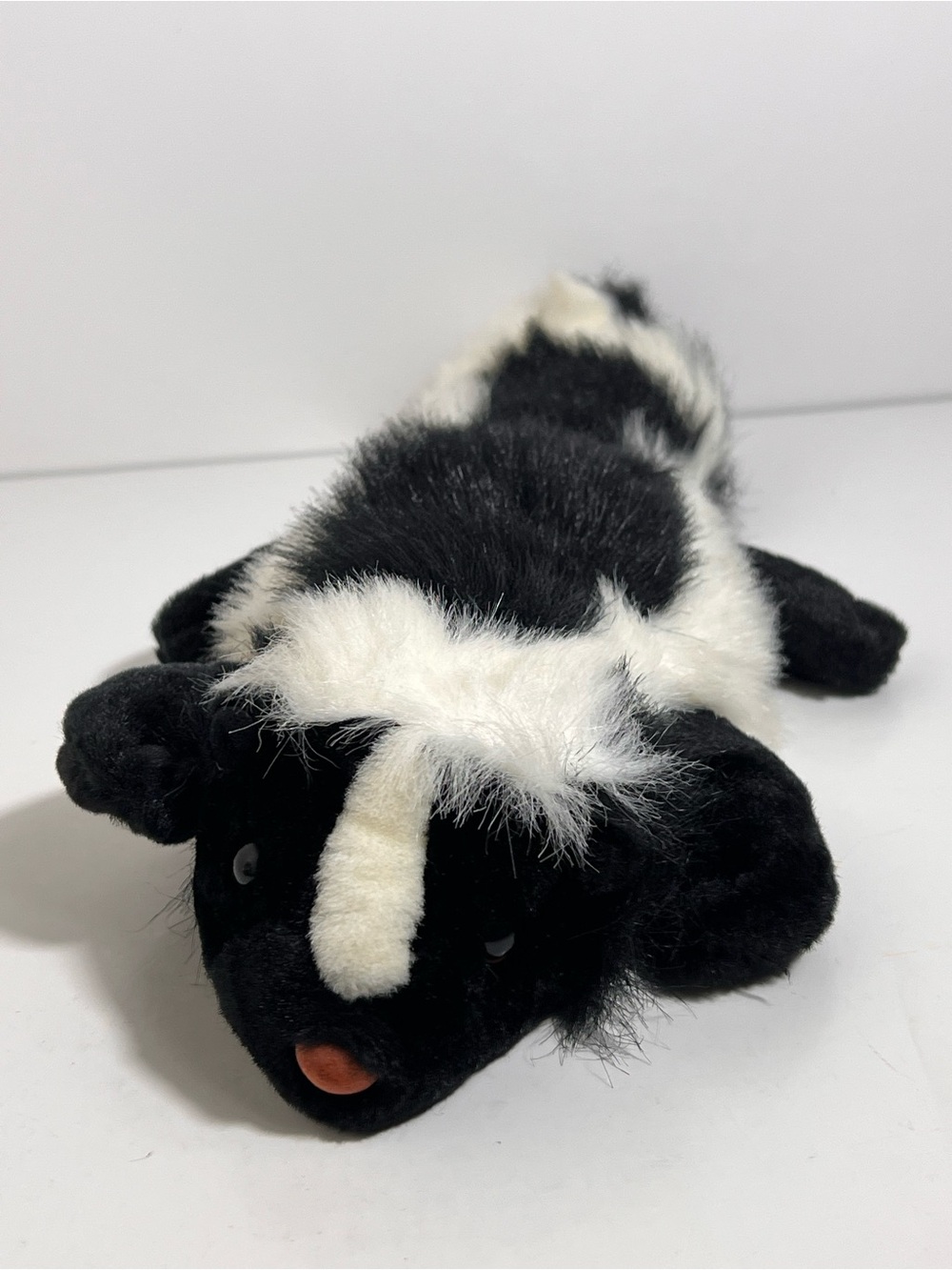 Tangerine Press Skunk Plush Stuffed Animal Laying Flat